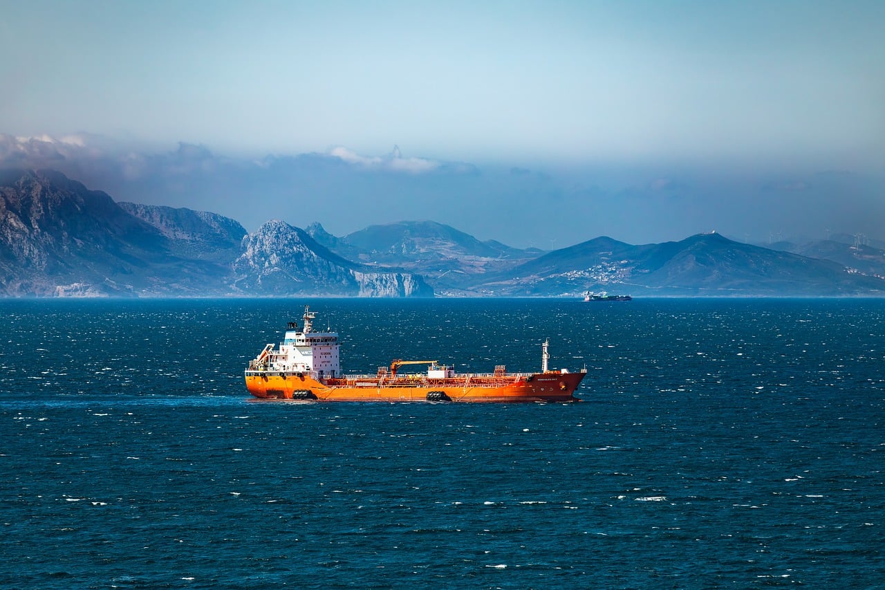 Cargo ship in a strait, cropped to the waterline